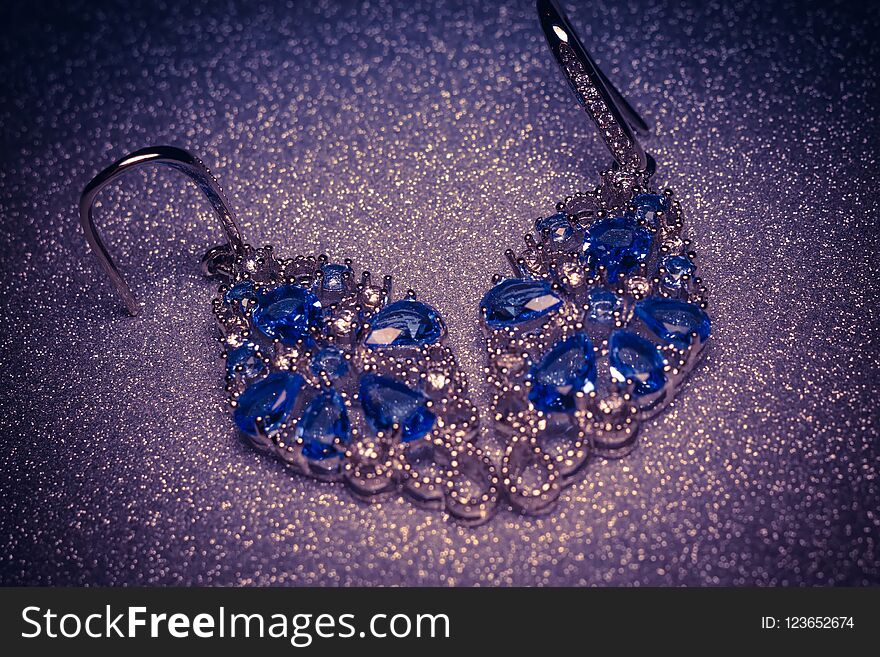 Fashion silver earrings with blue violet stone, tanzanite imitation. Fashion silver earrings with blue violet stone, tanzanite imitation.