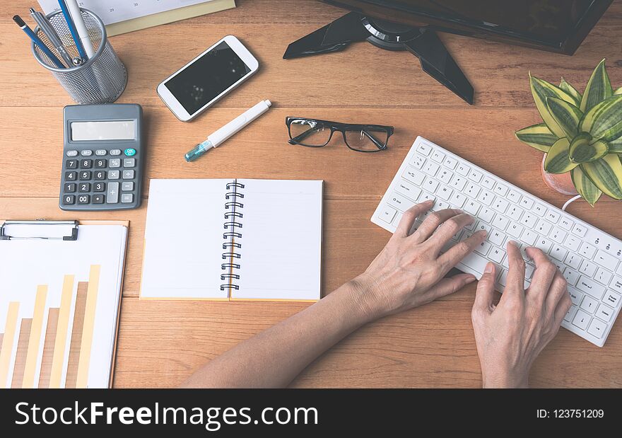 Businessman working and typing on keyboard for business and accounting concept.