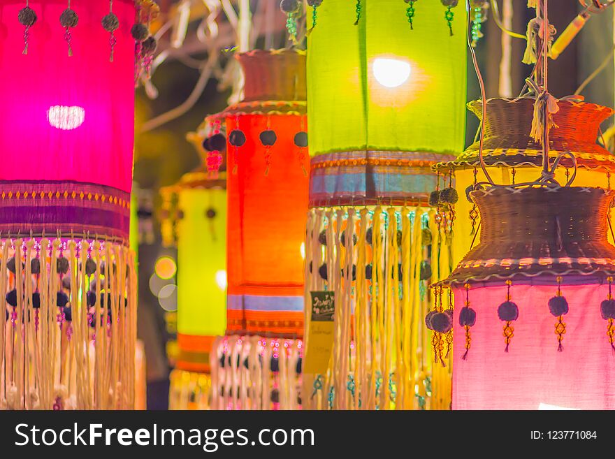 Colorful patterned on ceiling lantern with fabric in northeastern Thai style.