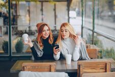 Two Girls In Cafe Royalty Free Stock Photography Two Girls In Cafe Royalty Free Stock Photography