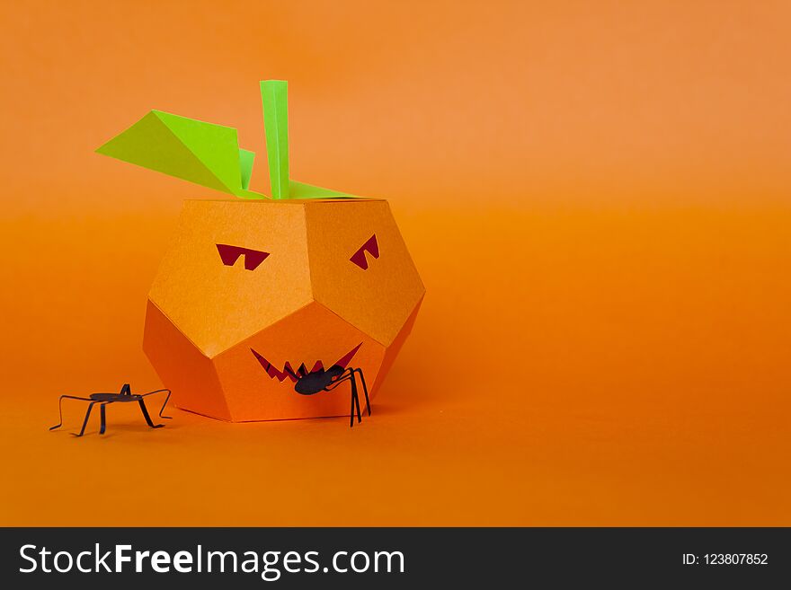 Happy Halloween. Halloween decor made of paper. Pumpkin made of paper