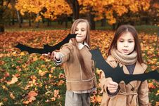 Halloween Bats. Two Sisters Playing In Autumn Park Stock Photography