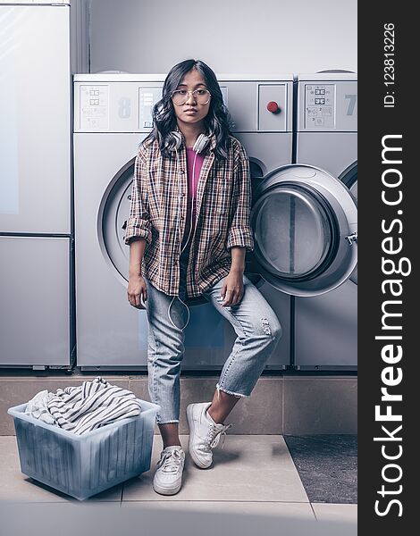 Attractive girl with a basket in laundry. Attractive girl with a basket in laundry