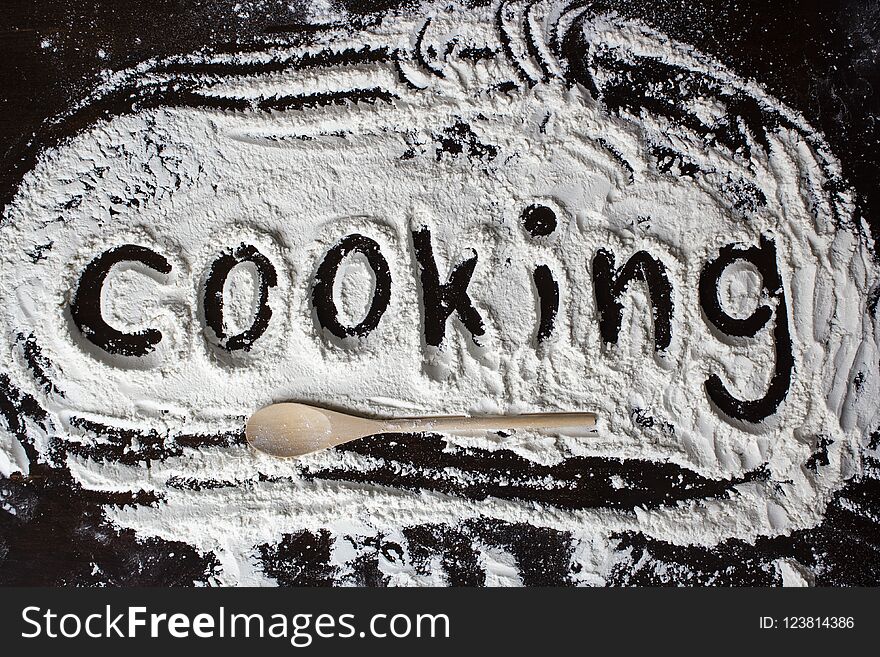 Cooking word written on the flour as surprise when cooking for your family