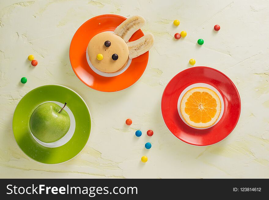 Funny bunny pancakes with fruits for Easter kids breakfast