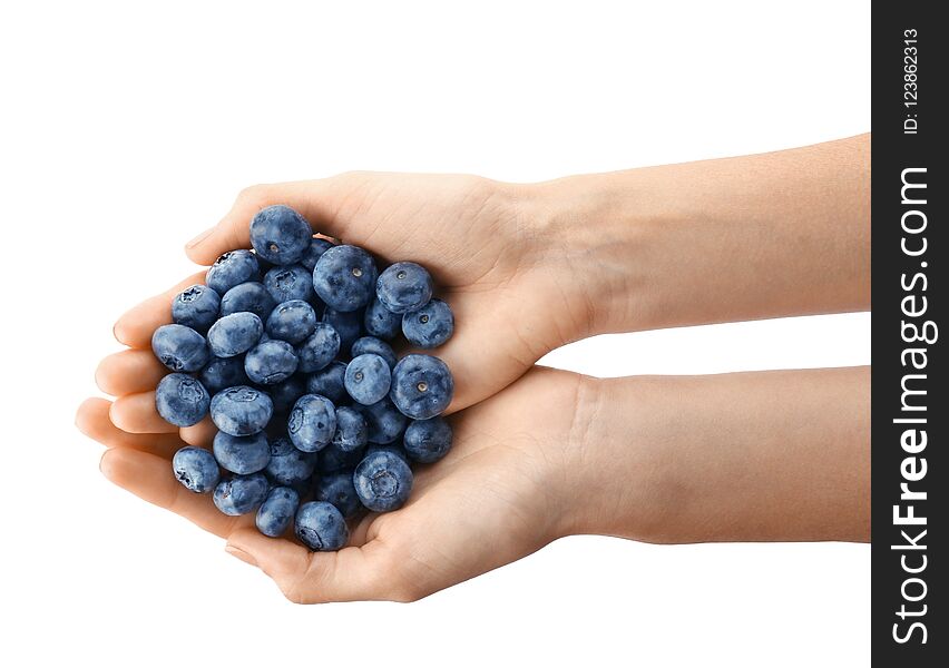 Woman holding fresh ripe blueberries