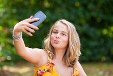 Girl With Smartphone Outdoors Stock Image