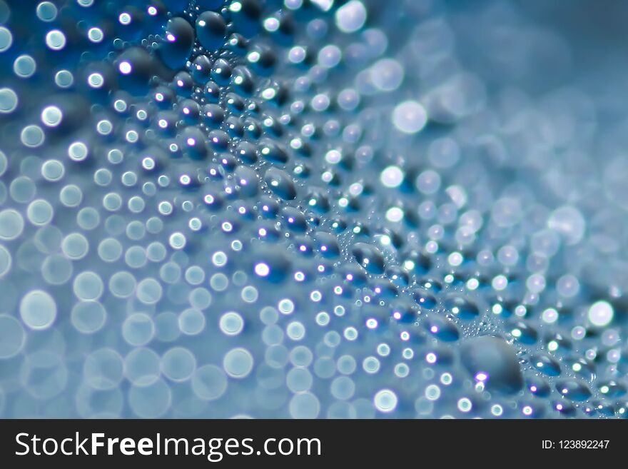 Close Up Water Drop Condensation With Blue Blur Bokeh