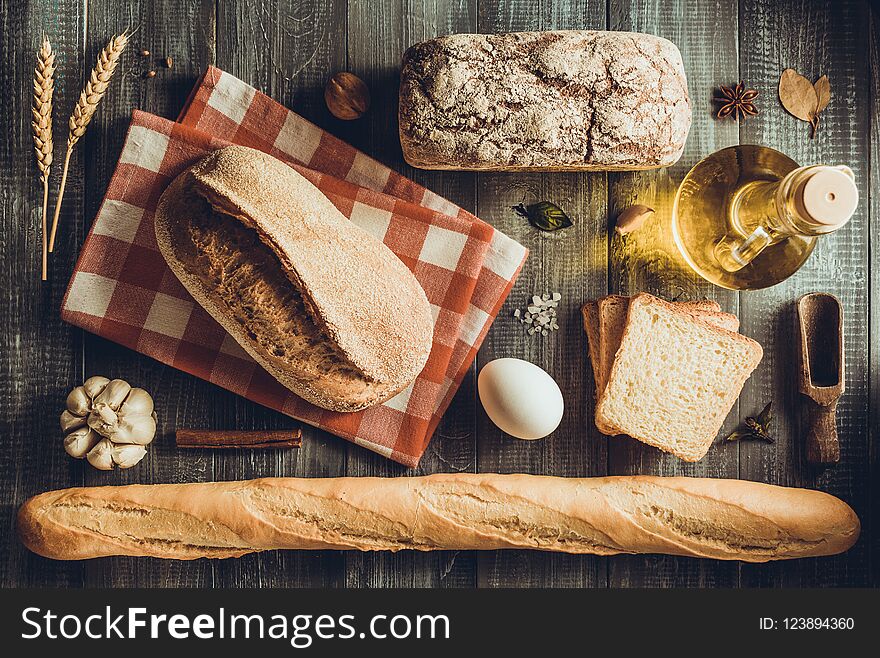 Bread and bakery products on wood background
