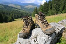 Hikers Boots On Stone Royalty Free Stock Images