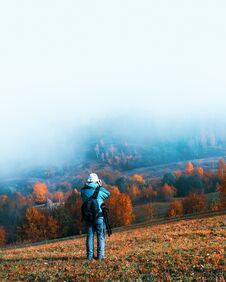 Photographer Taking Photo Of Autumn Landscape Stock Image