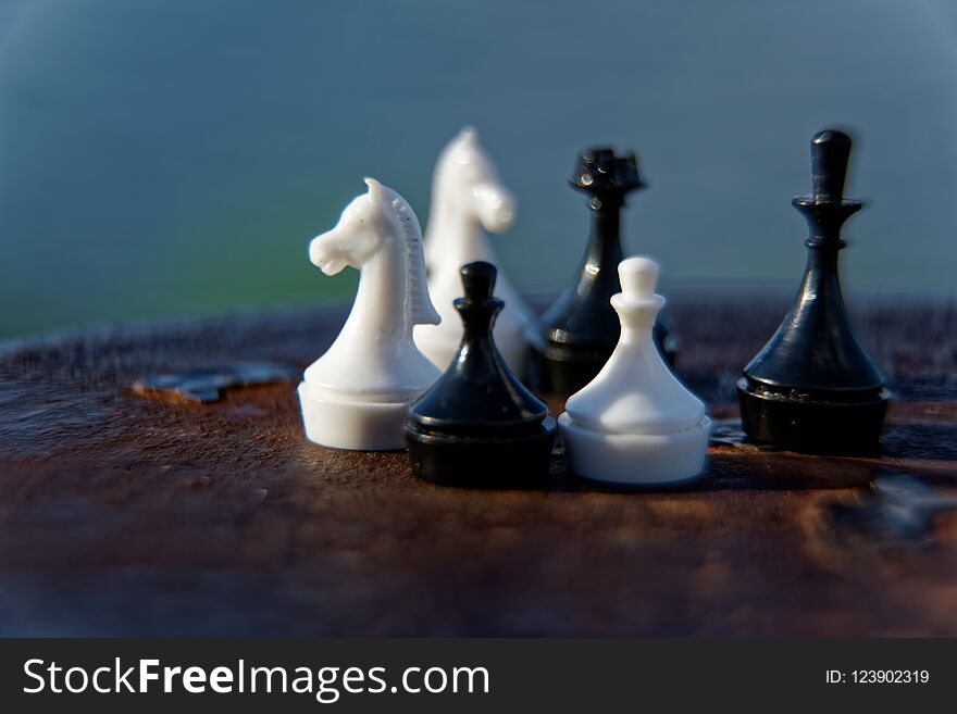 Macro chess pieces in motion with defocused background. Macro chess pieces in motion with defocused background.