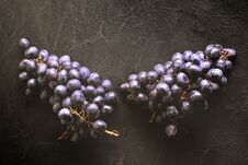 Fresh Ripe Bunches Of Black Grapes Berries On Kitchen Table Stock Photography