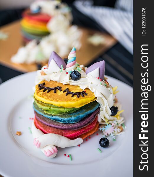 Fresh baked cute unicorn Rainbow Pancake with. kids meal.