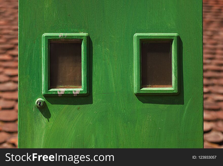 Details of a green electricity meters box, household equipment. Details of a green electricity meters box, household equipment.