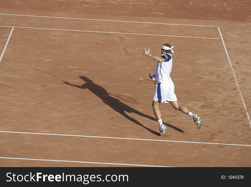 Tennis man in action on royal court. Tennis man in action on royal court