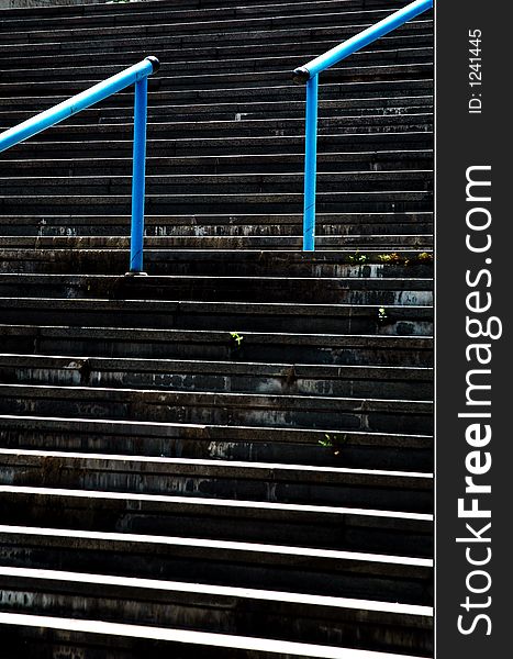 Concrete staircase and blue fencing. Concrete staircase and blue fencing