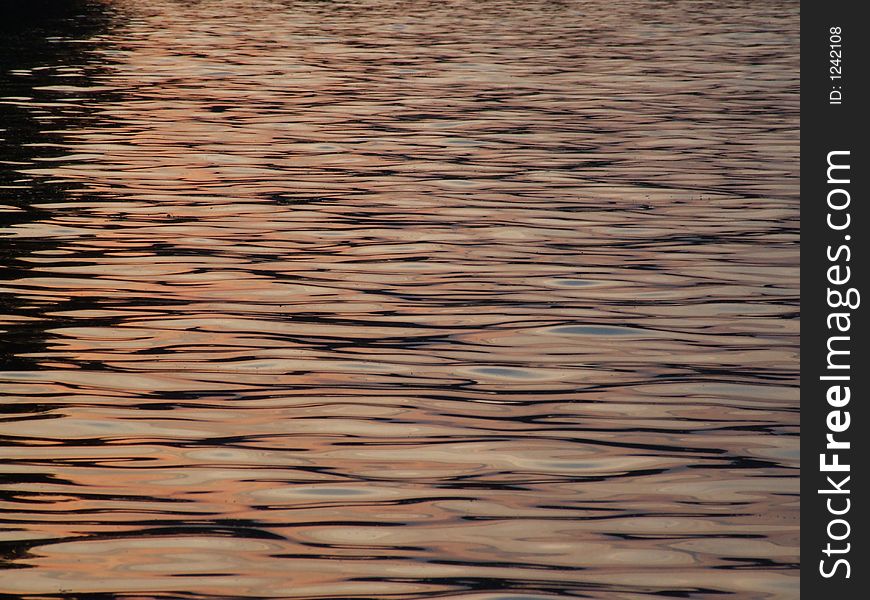 Sunset reflections on the lake surface. Sunset reflections on the lake surface