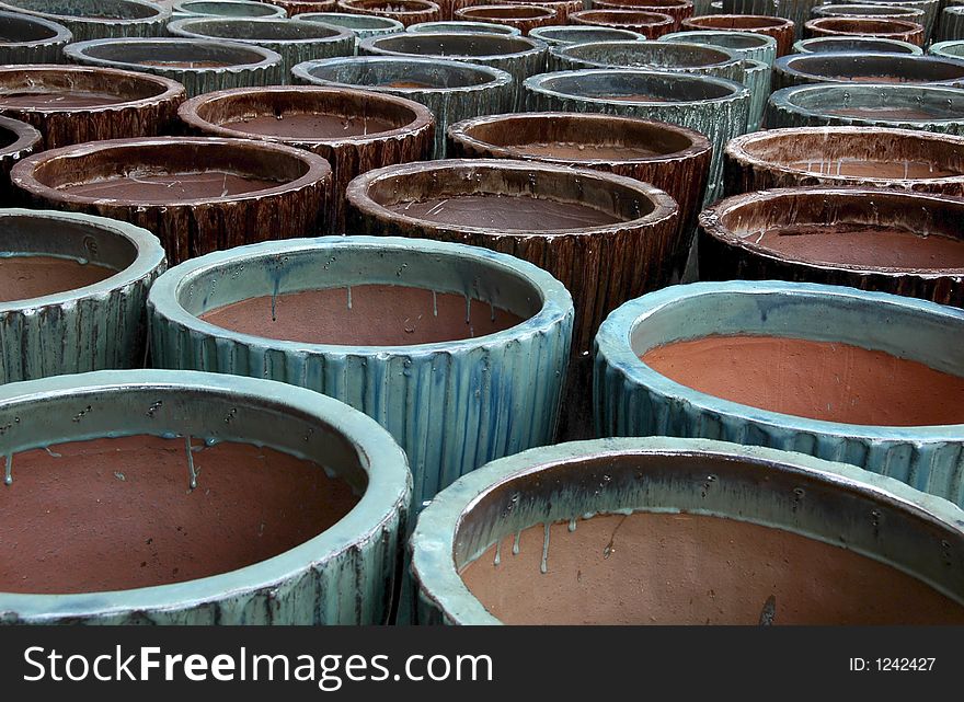 A large display of colorful pottery. A large display of colorful pottery