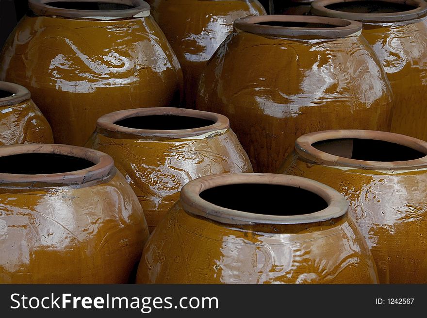 A large display of colorful pottery. A large display of colorful pottery