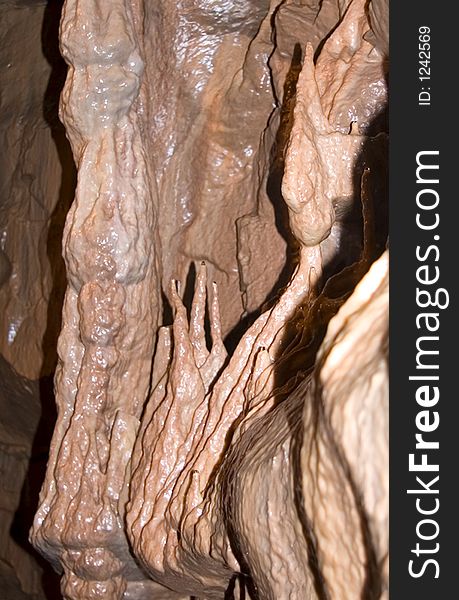 Rock formation on the side of cave wall.