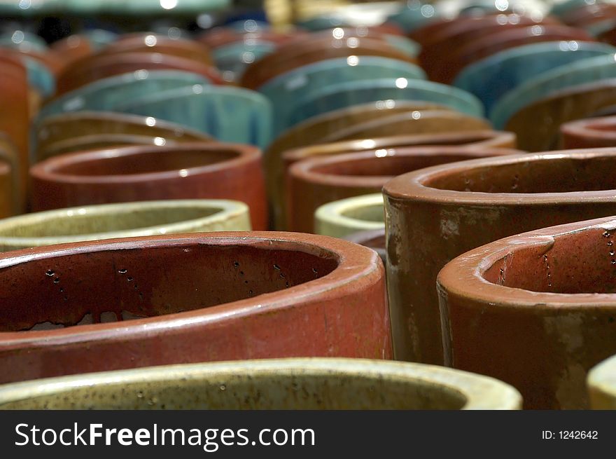 A large display of colorful pottery. A large display of colorful pottery