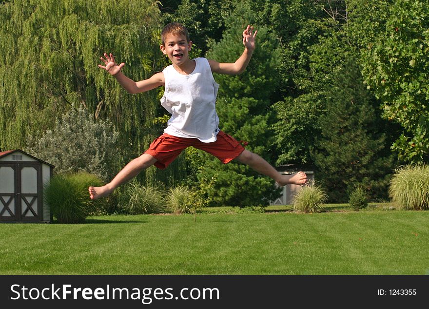 Boy jumping high on trampoline. Boy jumping high on trampoline