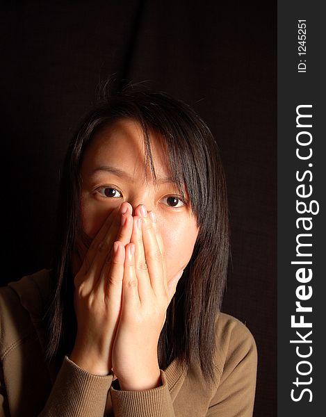 An asian chinese lady showing nervous expression