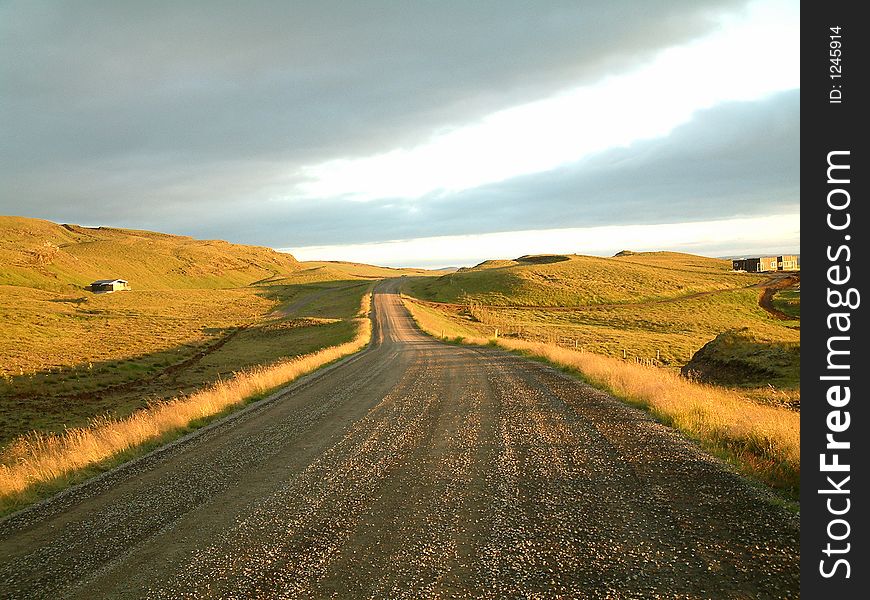 Road under an oblique light around midnight, somewhere in Iceland. Road under an oblique light around midnight, somewhere in Iceland