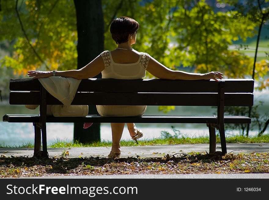 Woman sitting in a park. Woman sitting in a park