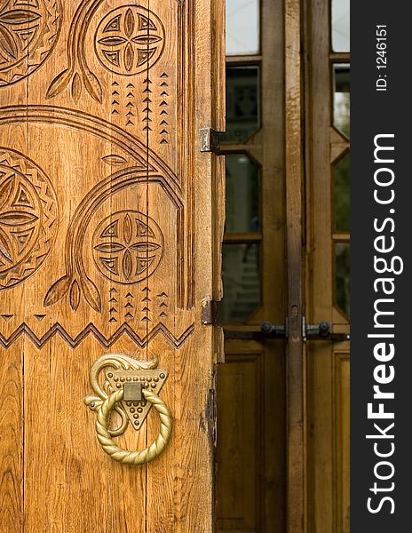 Ancient wooden door decorated with ukranian fretwork