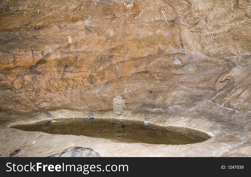 Pool in the floor of a cave. Pool in the floor of a cave.