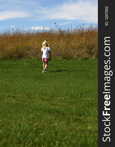 Girl walking in a prairie