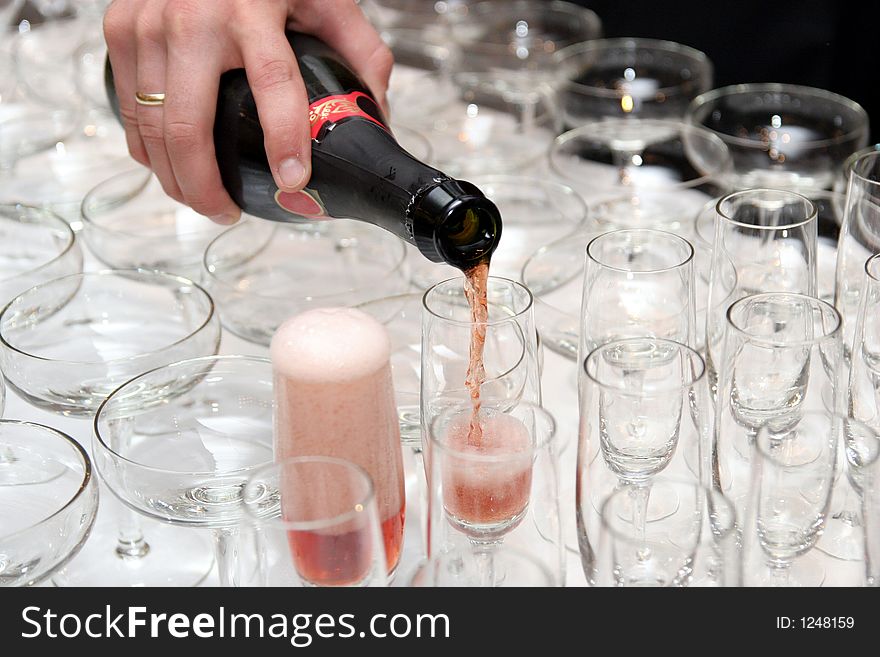 Pouring red wine in cup in restaurant