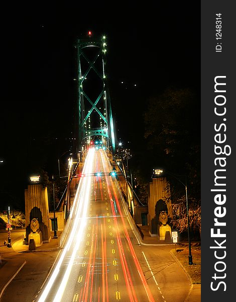 Bridge at night with car lights streaking