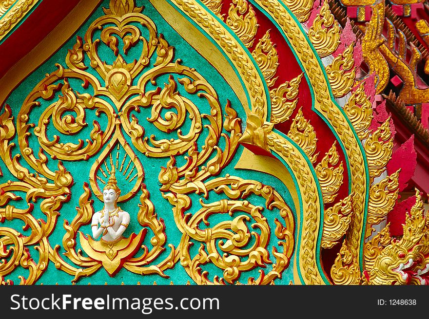 Buddhist temple details with layers of roofs at wat in Surat thani