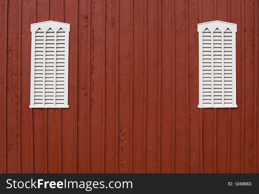 Louvered barn side with windows and central copy space