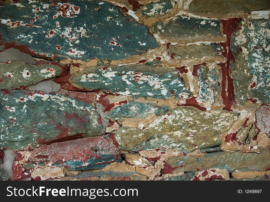 Weathered Paint on Stone with mortar and chipped paint