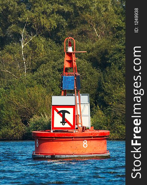 A red marker buoy powered by solar energy. A red marker buoy powered by solar energy