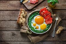 Sunny Side Fried Eggs In A Copper Pan With Tomatoes And Green Beans, Copy Space. Royalty Free Stock Image