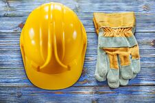 Safety Gloves Building Helmet On Vintage Wooden Board Royalty Free Stock Images Safety Gloves Building Helmet On Vintage Wooden Board Royalty Free Stock Images