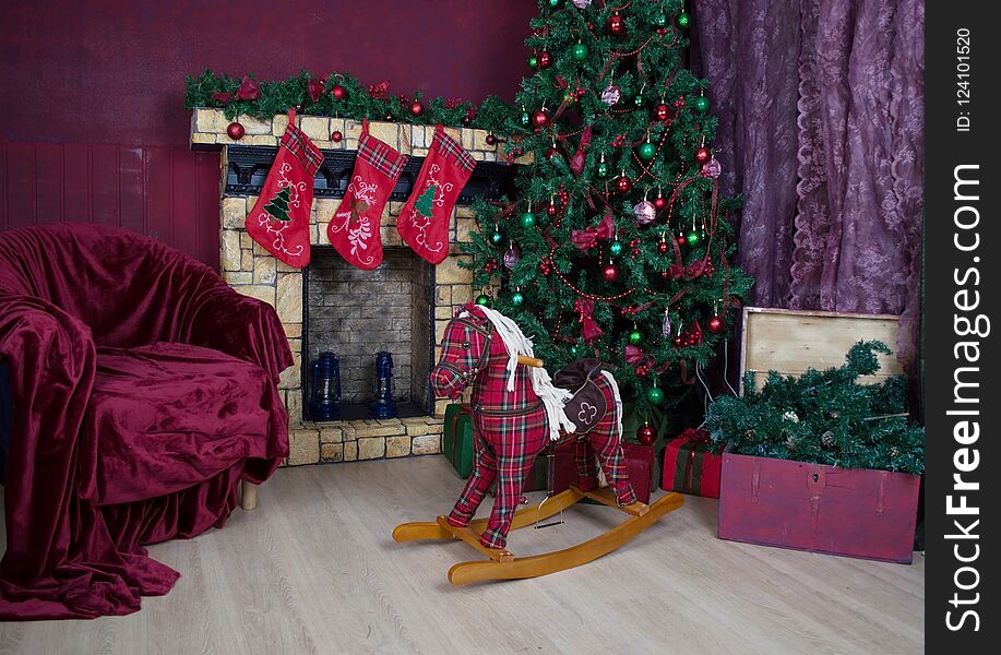 Place Christmas tree toy gifts children`s rocking horse chair. Place Christmas tree toy gifts children`s rocking horse chair