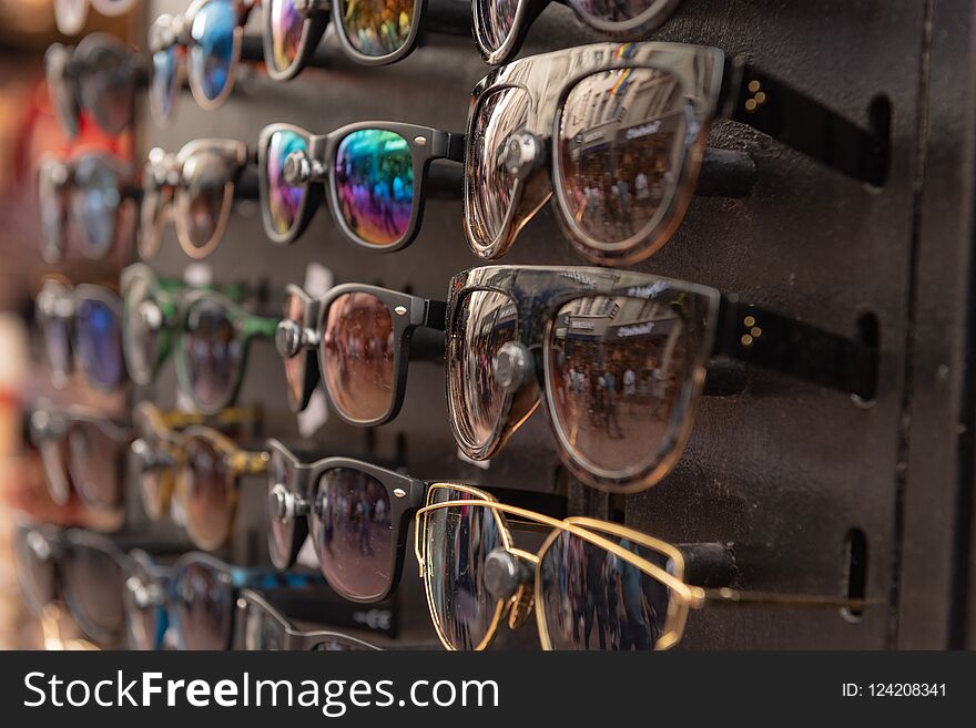 Many sunglasses on the street market