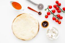 Make Pizza Concept. Pizza Dough And Ingredients For Filling. Cherry Tomatoes, Olive Oil, Cheese Mozzarella, Spices Near Royalty Free Stock Images