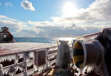 Ice Of The Ship And Ship Structures After Swimming In Frosty Weather During A Storm In The Pacific Ocean. Stock Photo