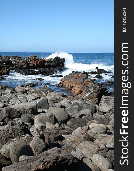 Waves splash on rocks along the west coast of the island of Molokai, Hawaii. Waves splash on rocks along the west coast of the island of Molokai, Hawaii.