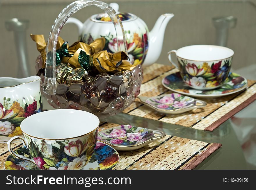 The covered table for tea drinking with tea service