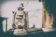 Old Vintage Camping Lantern On Wooden Table. Royalty Free Stock Photo