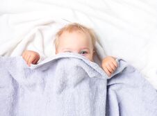 Baby Child In Bed Covering With Blanket.Nursery For Kids. Royalty Free Stock Photography