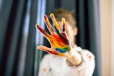 Woman Showing Stop Gesture, Hand Painted In Colorful Paints Royalty Free Stock Image